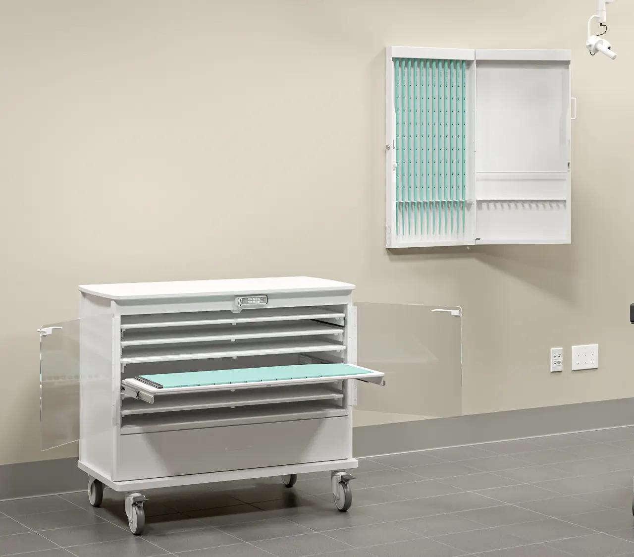 A dilator storage cart and a wall-mounted cabinet in a procedure room