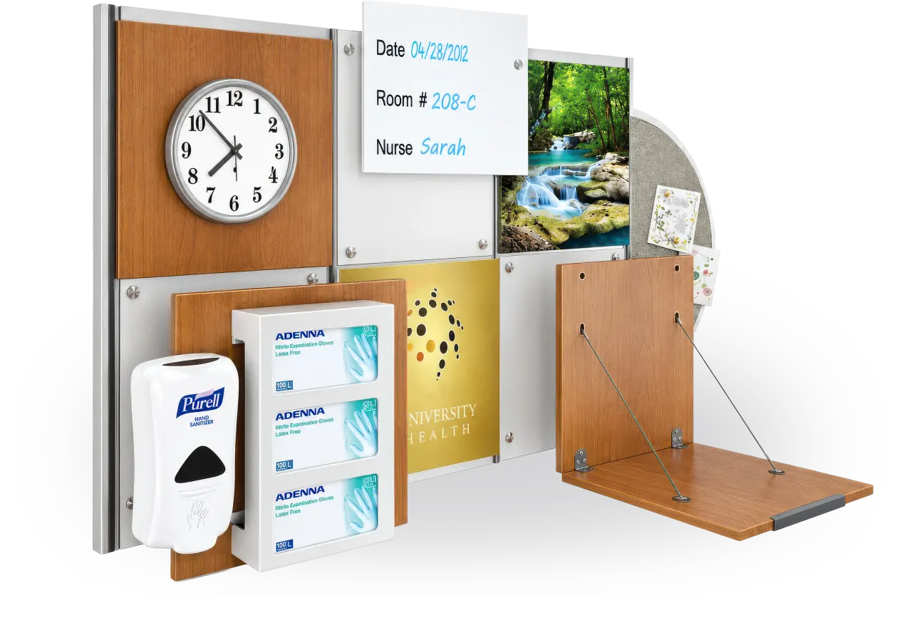 A Raspberry Med modular wall system: rail-mounted panels with a clock, a patient whiteboard, sanitizer, gloves and a fold-down worksurface